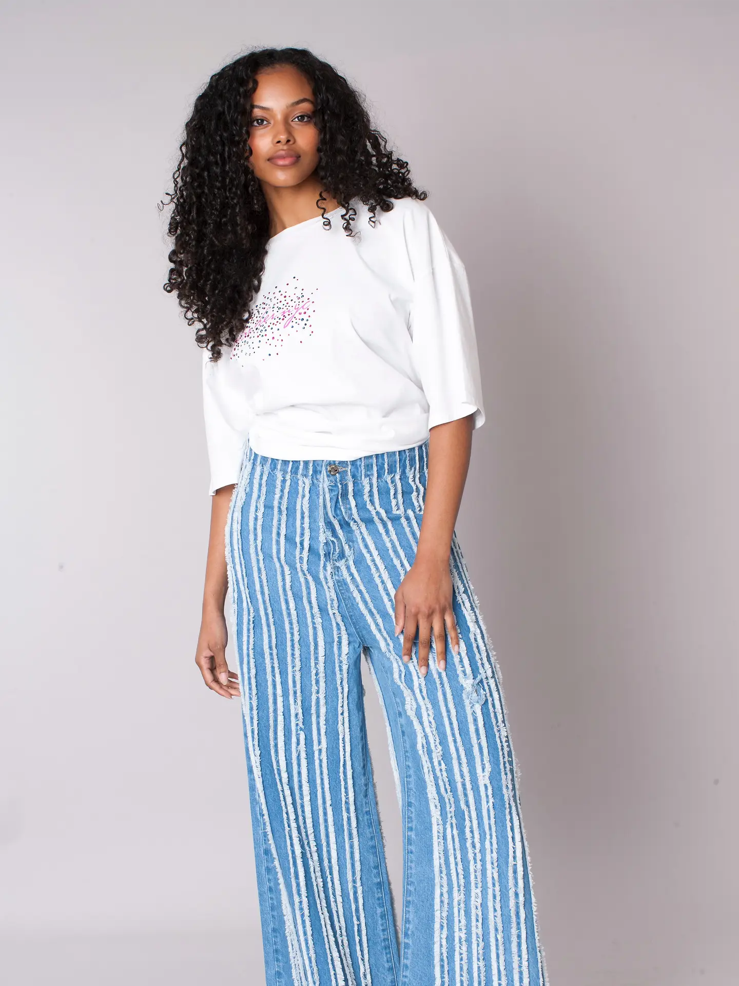 Asymmetric Stripe Top with Statement Bow & Vertical Distressed Stripe Denim Jeans